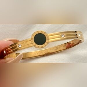BVLGARI 18k Yellow Gold with Black Onyx Bangle w/ clasp closure